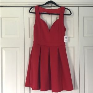 Large Red Dress with a Heart Shape Cutout on Back